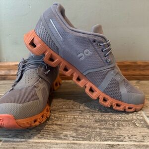 On Running Gray and Orange Athletic Shoes with Cloud Cushioning